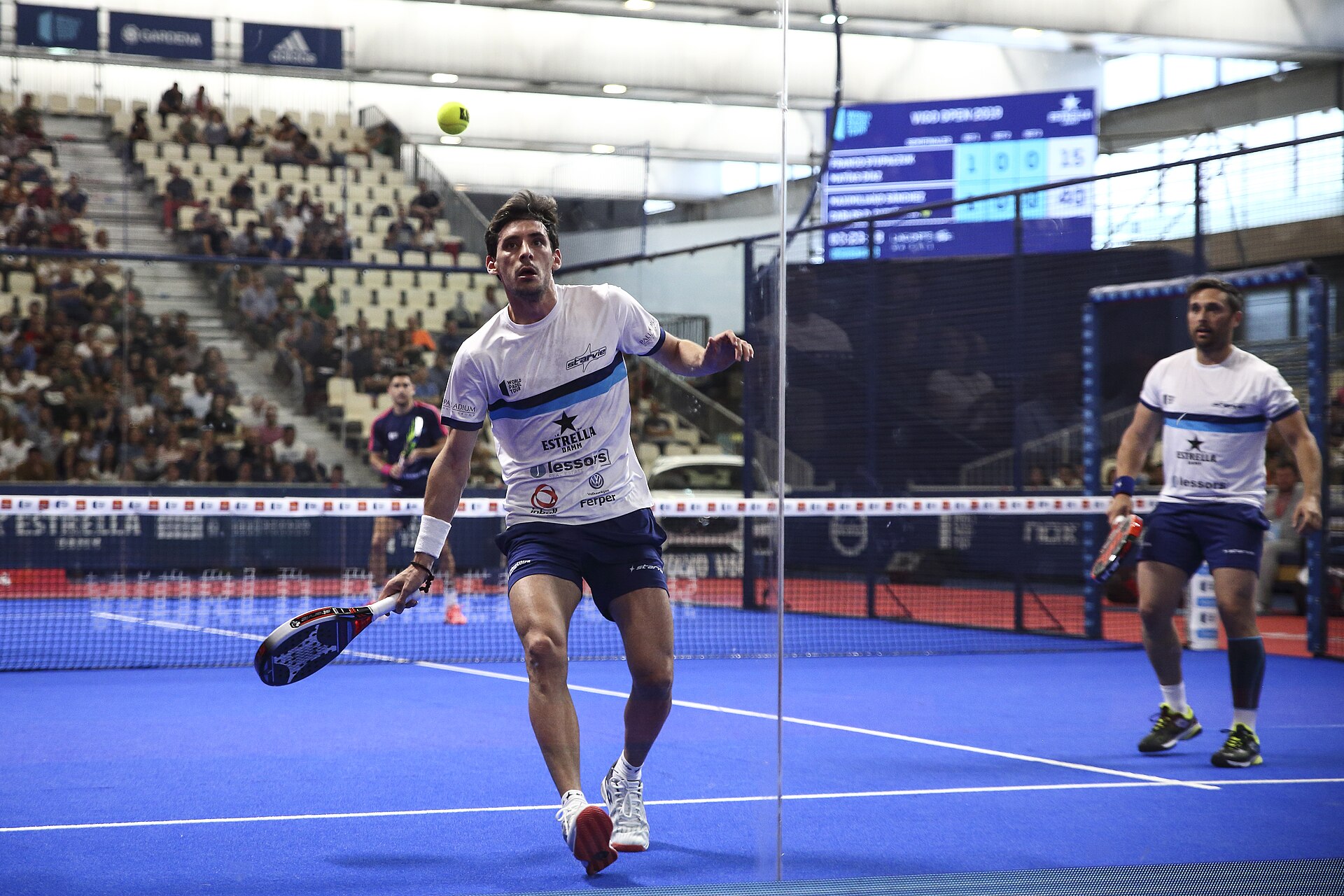 Professional padel players in action during a tournament